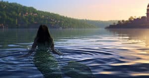 mermaid swimming in a river.