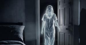 female ghost walking into a bedroom