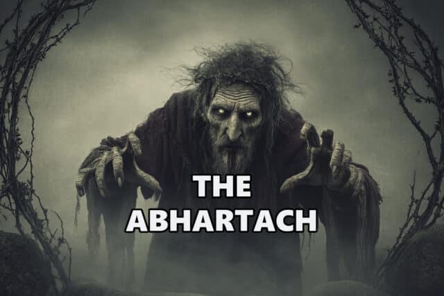 Abhartach, Ireland's legendary vampire dwarf king, emerging from a grave on a foggy Irish hillside at night with blood-stained mouth and glowing eyes