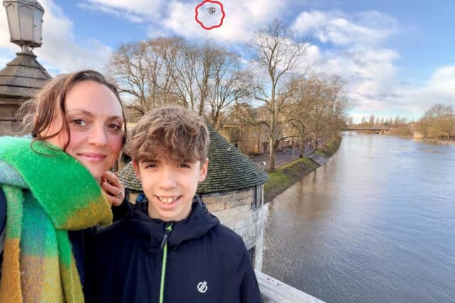 Mother and son capture a UFO in their selfie.